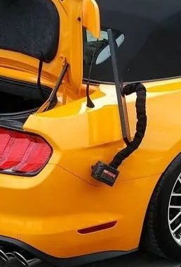 In this PDR job on a yellow mustang the dent is accessible through the trunk