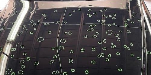 marked spots to determine hail damage repair costs